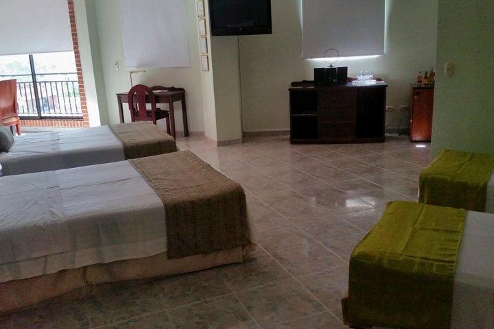 Casa Morales Hotel Internacional Y Centro De Convenciones Ibagué Εξωτερικό φωτογραφία A room at the hotel