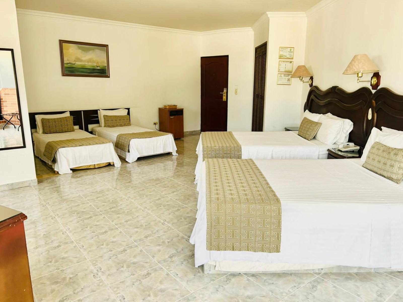 Casa Morales Hotel Internacional Y Centro De Convenciones Ibagué Εξωτερικό φωτογραφία A room at the hotel