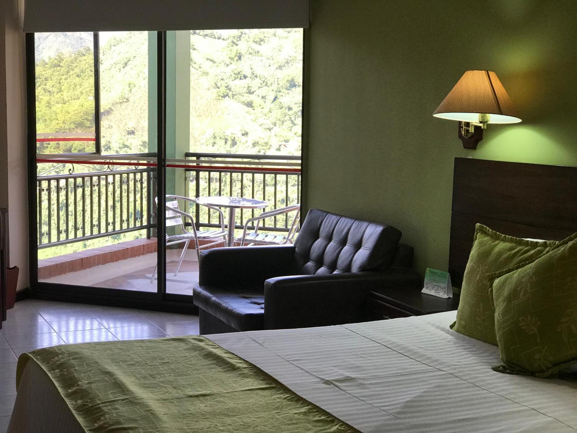 Casa Morales Hotel Internacional Y Centro De Convenciones Ibagué Εξωτερικό φωτογραφία A room at the hotel